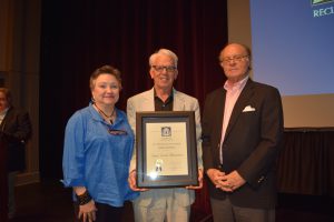 Jim Wooten, center, and his wife, Ann, accept an award from Mark McDonald, CEO of The Georgia Trust for Historic Preservation, for Excellence in Restoration for Sugar Creek Plantation in McRae-Helena, Georgia.
