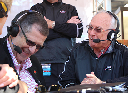 Dean Charles Davis and Loran Smith share a laugh during the tailgate show in October 2014.
