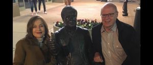 2017 Academy Award nominee Isabelle Huppert is pictured with a statue of Roger Ebert giving his famous 'thumbs-up' and Eberfest Director Nate Kohn.