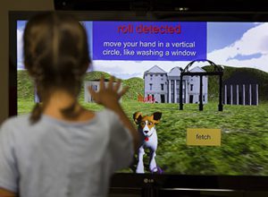 The virtual dog that children interact with does a series of tricks including fetch, roll-over and stand-up, among others.