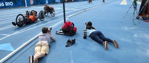 Casey Sykes (AB ’18) and a student from Penn State photograph athletes during the Paralympic Team Trials in July 2016. Six current Grady College students will have similar experiences covering adaptive sports at the Warrior Games June 1-7, 2018.