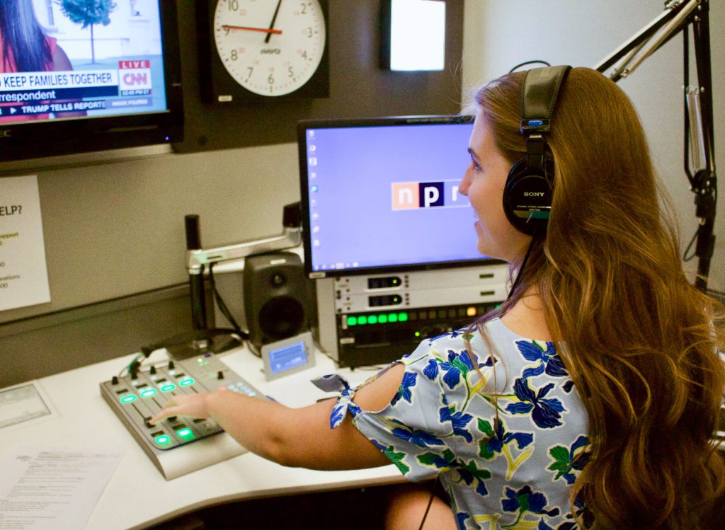 Charlotte Norsworthy operates a sound booth in NPR's newsroom. Photo: Alexis Arnold