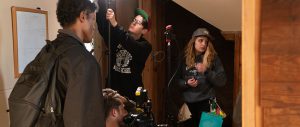 Connor Pannell (bottom picture, behind camera), Alex Newberry (middle picture with hat) and Vivian Zingleman (far right) work together to get the scene set during the making of “Burnt Offering.” (Photo courtesy of Connor Pannell)