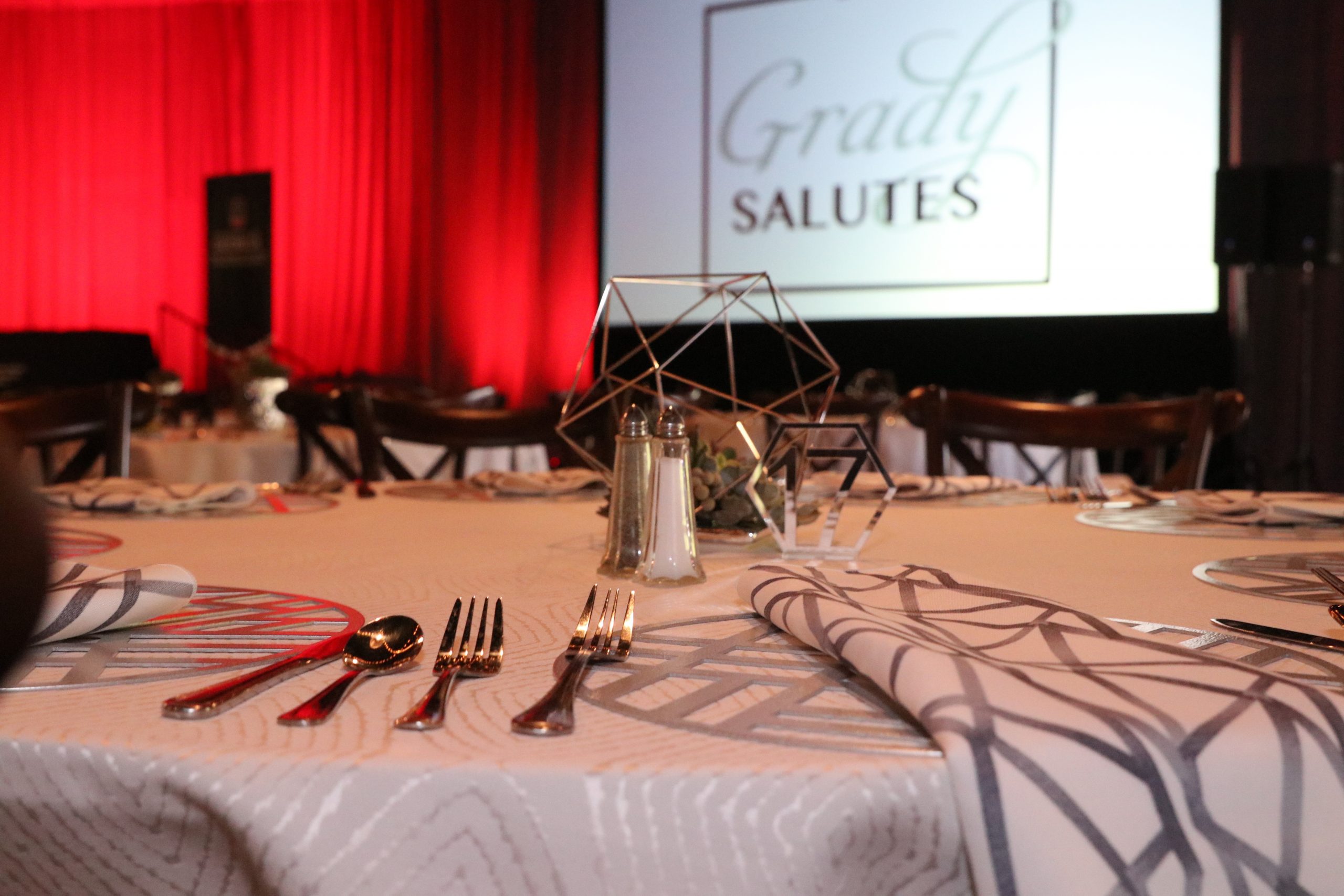 Place settings on a table at the 2019 Grady Salutes event.