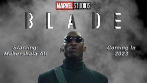 A conceptual design for the upcoming movie Blade features a black and smokey background with the Marvel Studios red and black logo at the top. The title Blade is in an angular, silver font. The starring actor’s name, Mahershala Ali, is listed in an outlined white font on the left. An image of the actor appears in the middle. The premiere date of “Coming in 2023” is included in the white outlined font on the right side of the poster.
