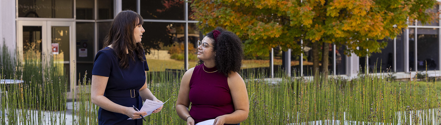 Brittney Minor and Meagan Perry talk outside Grady building. 
