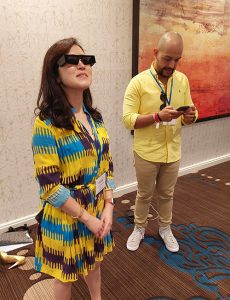 Grace Ahn trying out Snap Spectacles at the AAA conference.
