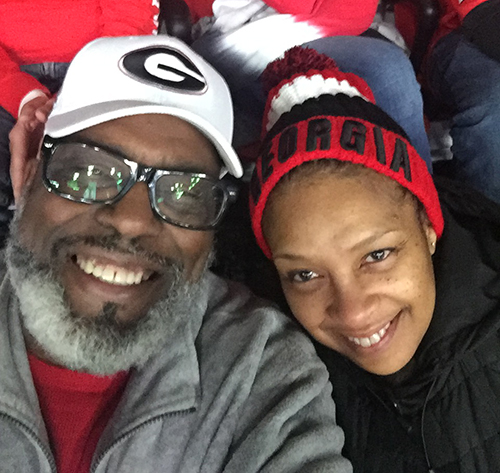 Reggie Hicks and his wife, Anita, at the National Championship game in 2018.