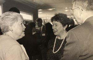 Beverly Bethune talks with Mr. and Mrs. Ernie Hynds at a reception