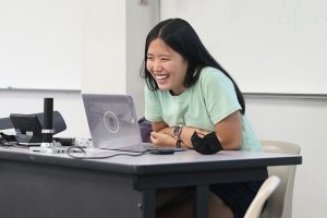 Sherry Liang laughs during a meeting of The Writer's Room