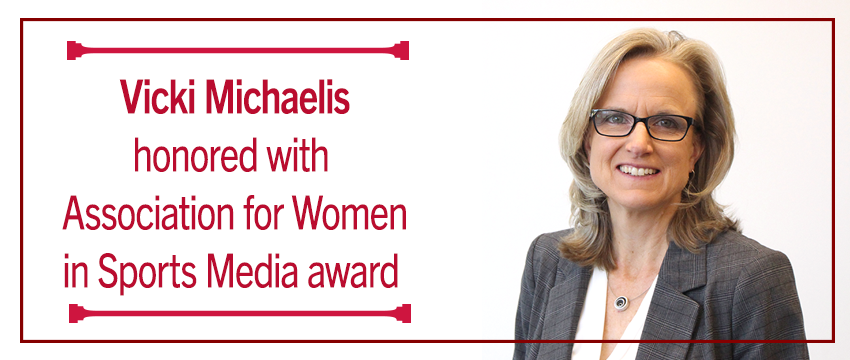 Headshot of Vicki Michaelis with text "Vicki Michaelis honored with Association for Women in Sports Media award."