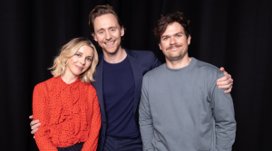Waldron (left) stands next to Tom Hiddleston and Sophia Di Martino, the two stars of the Loki series.