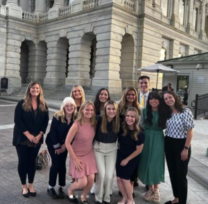Amanda Maddox and the Grady DC students stand outside the Senate side of Capitol Hill, where Maddox used to work and took Grady students.