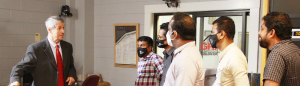 Tudor Vlad walks a group of Sri Lankan journalists through Grady Newsource facilities.