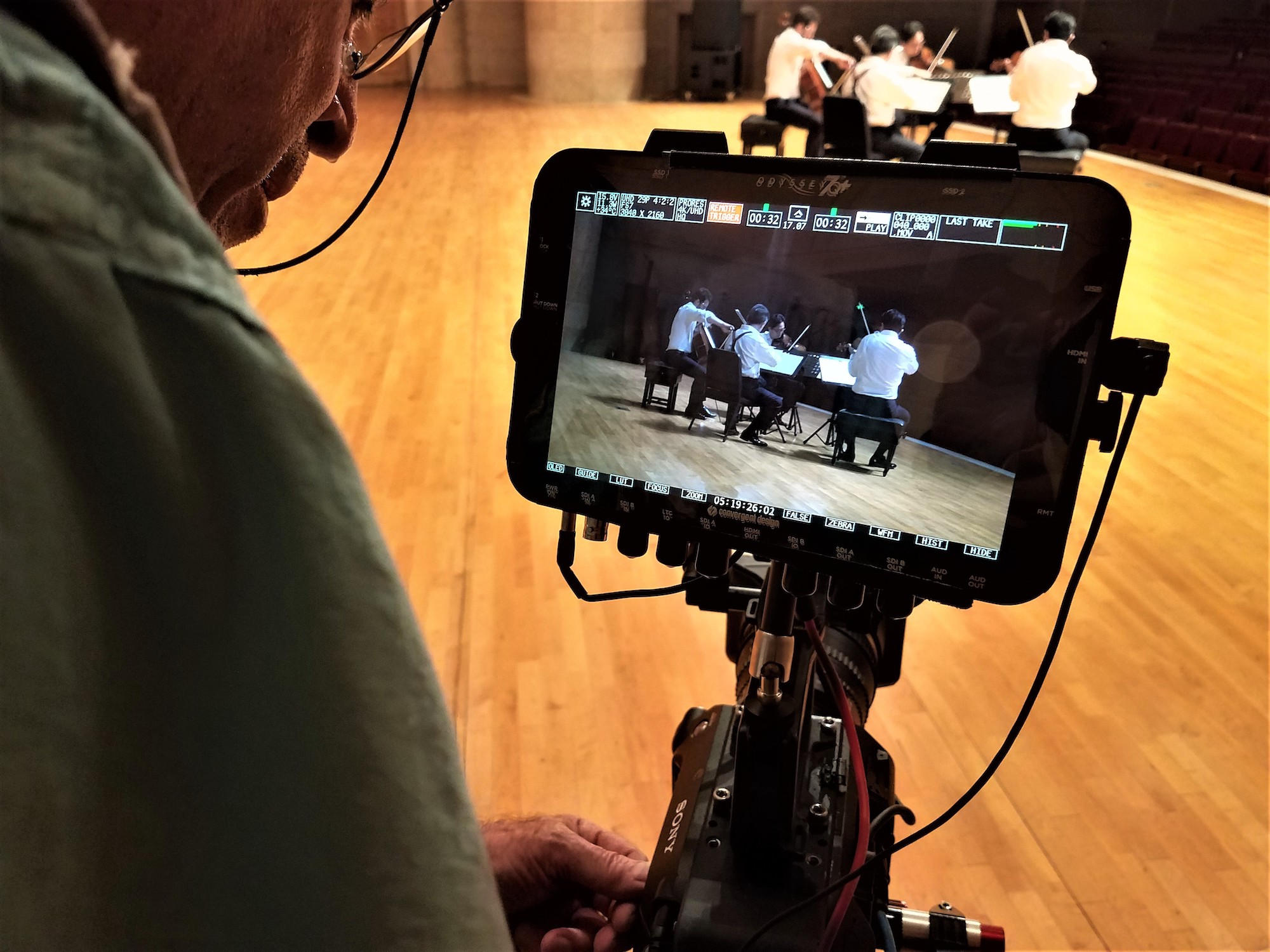 Rifken shoots video of the Shanghai Quartet. 