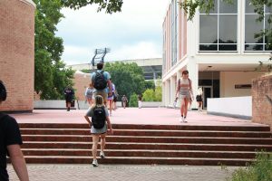 Students walk outside of Grady College during the first day of classes 2022.