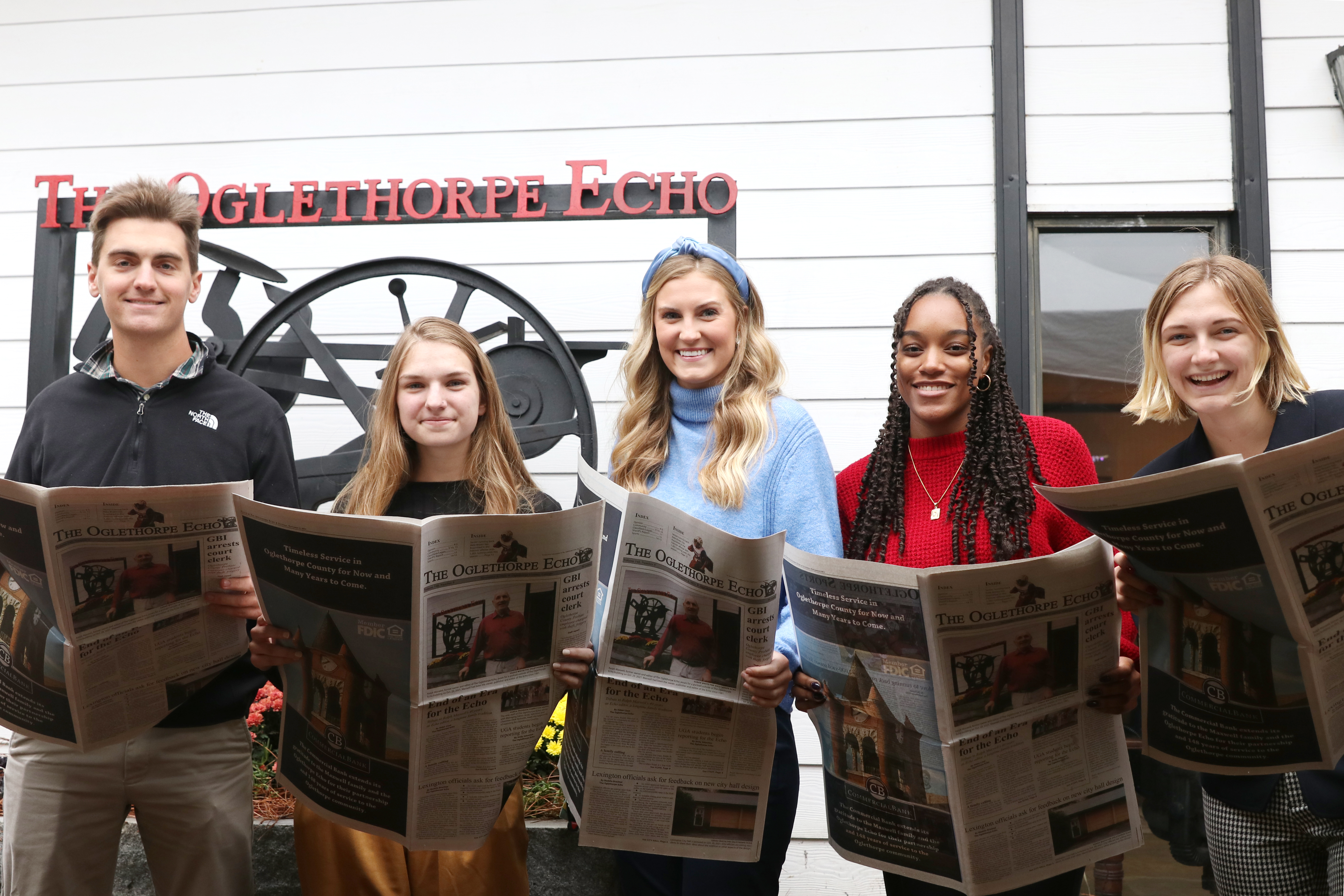 Former student journalists stand in front of the Oglethorpe Echo office. 