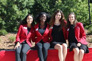 Grady Ambassadors pose for a photo during the celebration of the Schnitzer Family Media Lawn. 