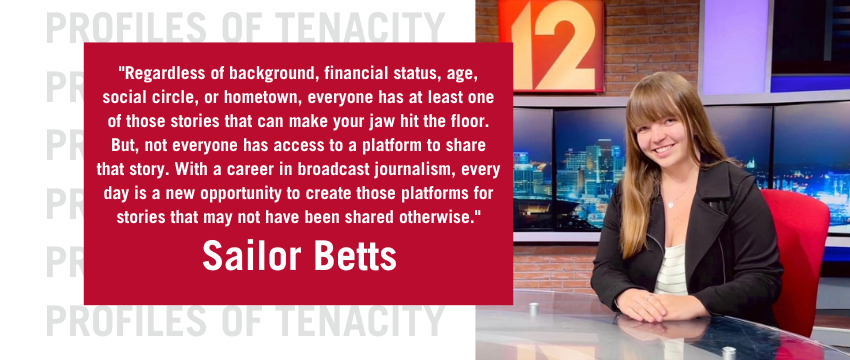 Sailor Betts is pictured sitting at the anchor desk during her summer 2022 news internship with Local 12 WKRC-TV. She is quoted, saying, "Everyone has an incredible story. Regardless of background, financial status, age, social circle, or hometown, everyone has at least one of those stories that can make your jaw hit the floor. But, not everyone has access to a platform to share that story. With a career in broadcast journalism, every day is a new opportunity to create those platforms for stories that may not have been shared otherwise."