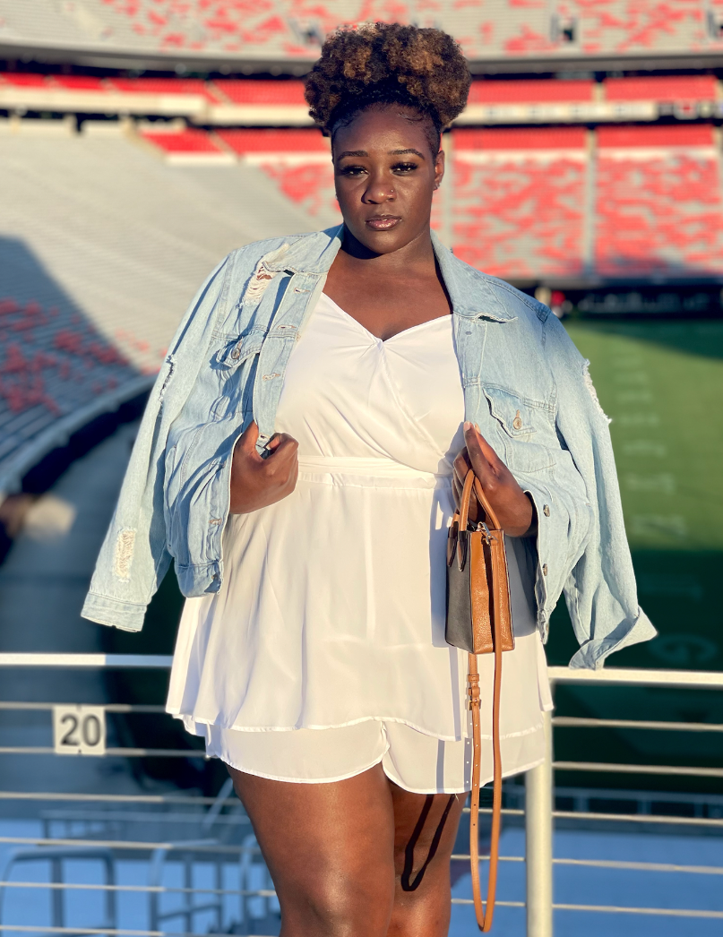 Destiny Hartwell standing in front of Sanford Stadium. 