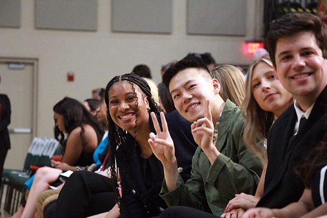 Students smile as they wait for the convocation ceremony to begin.