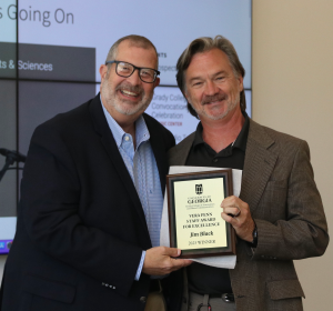 Jim Black holds up his award plaque with Dean Davis.