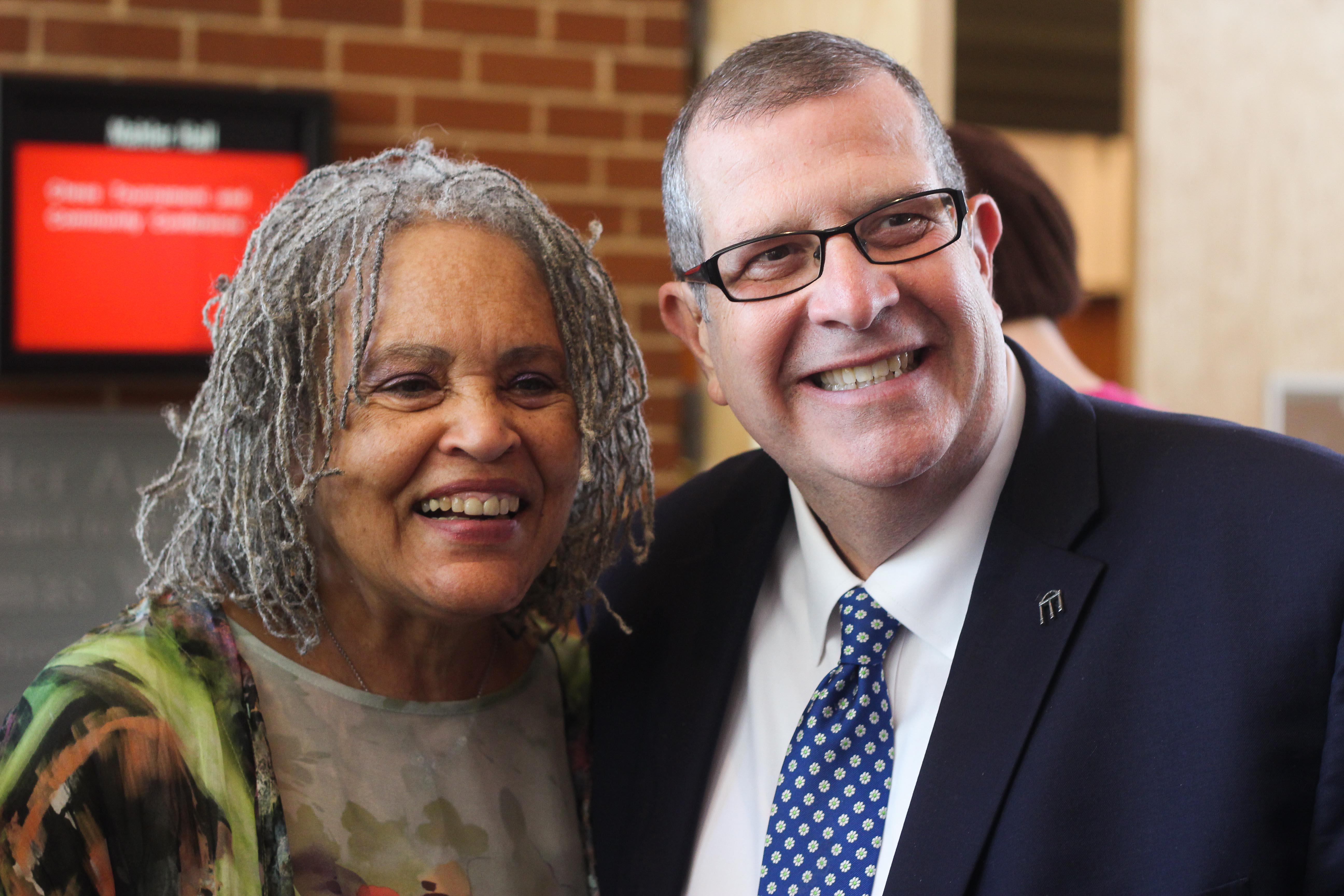 Charlayne Hunter-Gault poses for a photo with Dean Charles Davis (right). 