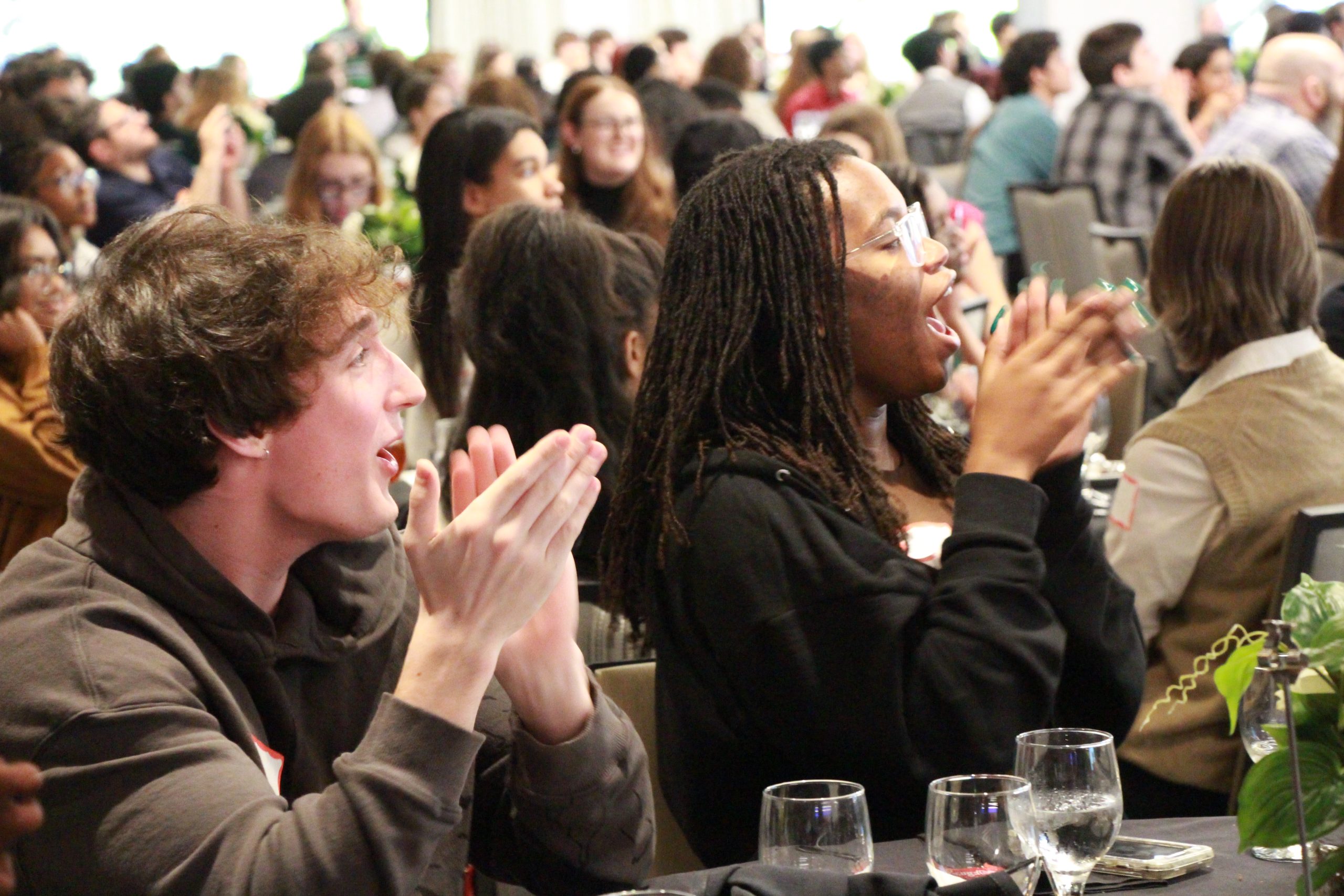 Students clap while sitting down during the GSPA Awards.