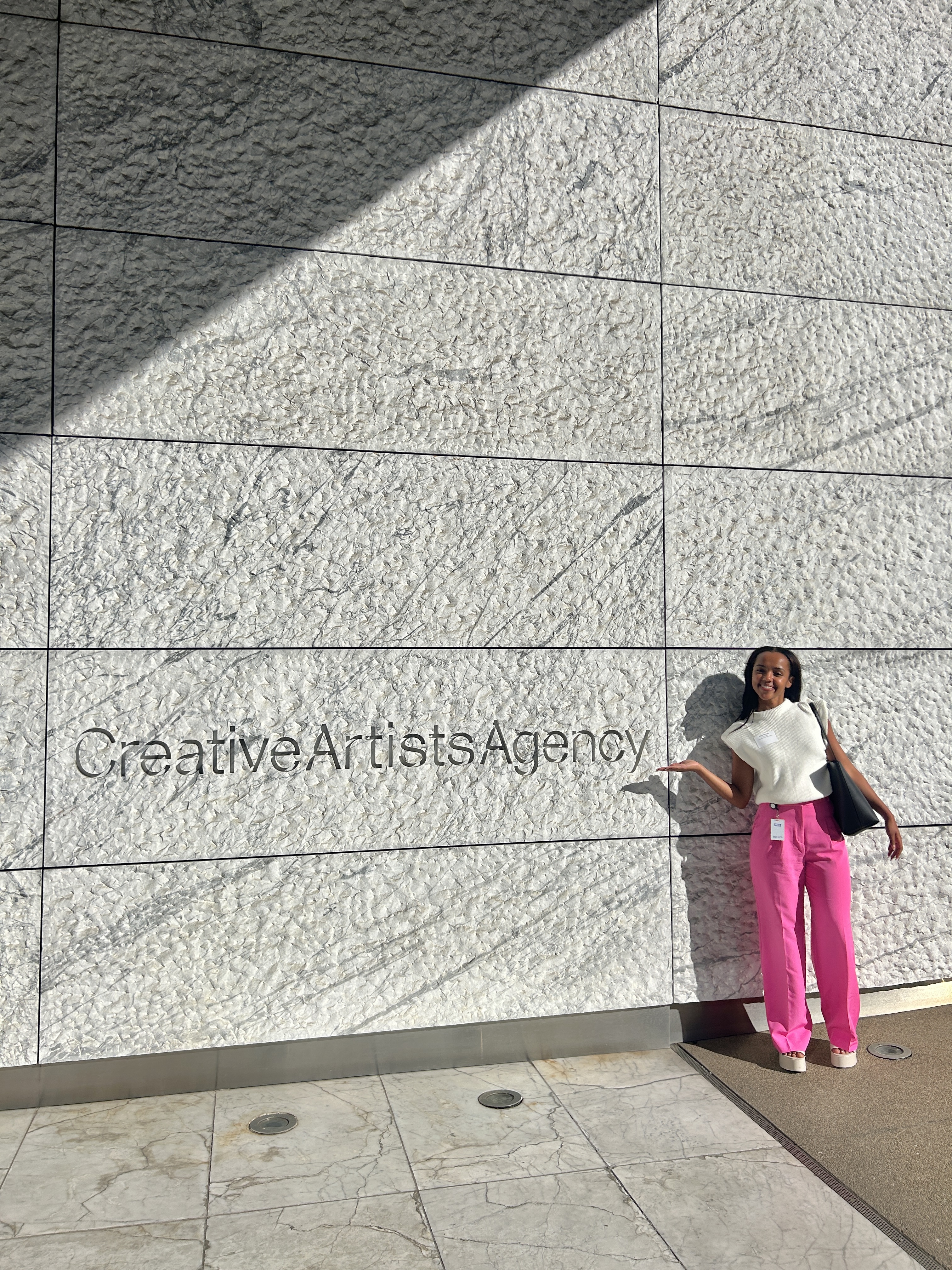 Photo of a person standing in front of the Creative Artists Agency