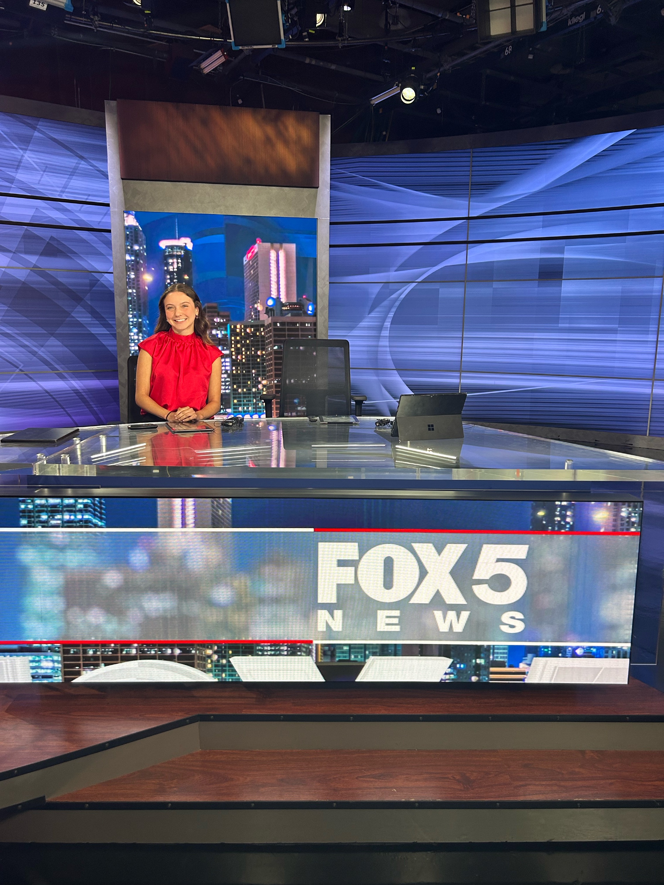 Photo of Elizabeth Hunter sitting at the Fox 5 Atlanta news desk. 