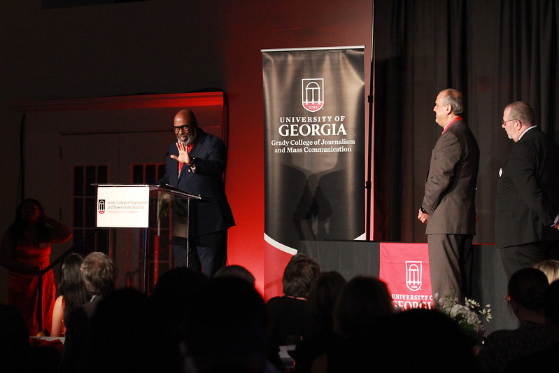 Reggie Hicks gives a speech after accepting his award during Grady Salutes 2022.