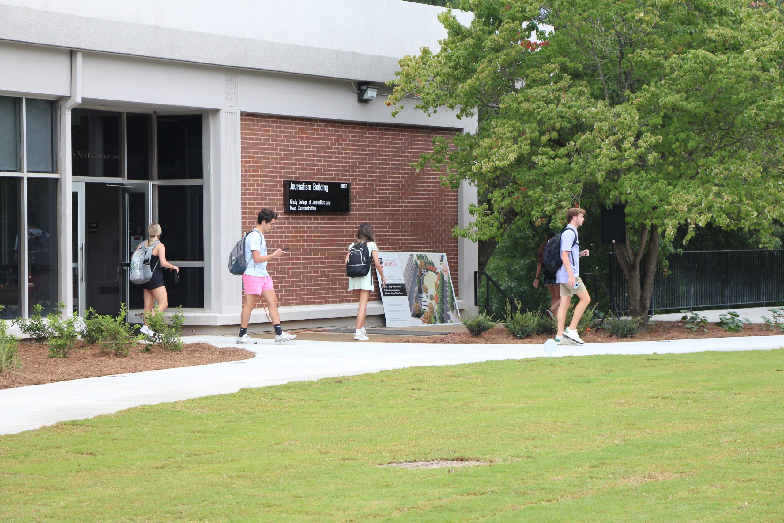 Students walking outside of Grady College.