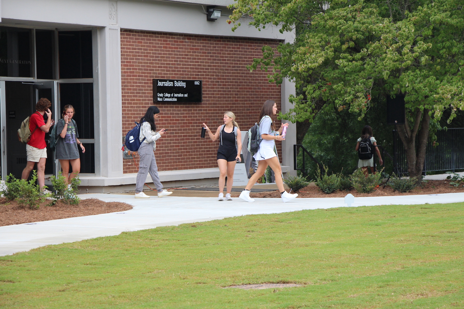 New and returning students walk out of Grady during the first day of classes 2022.