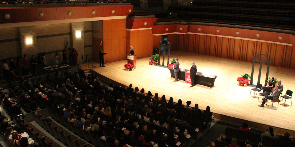 A overhead shot of the crowd and stage at Convocation.