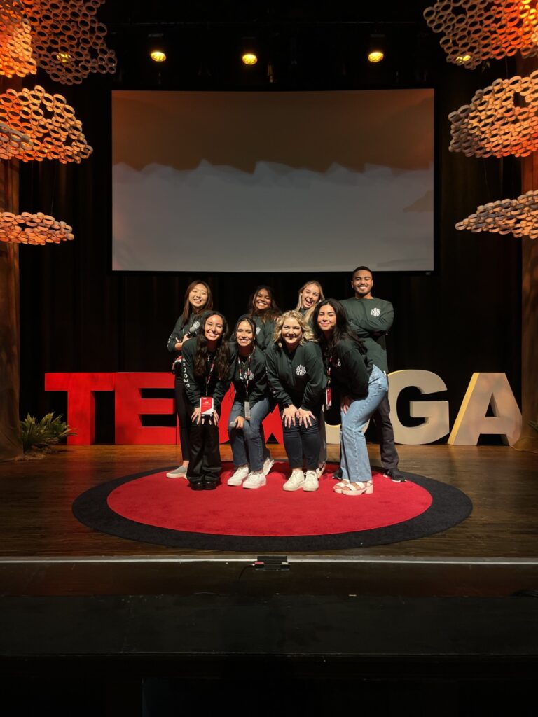Valdes poses with students at TEDxUGA.
