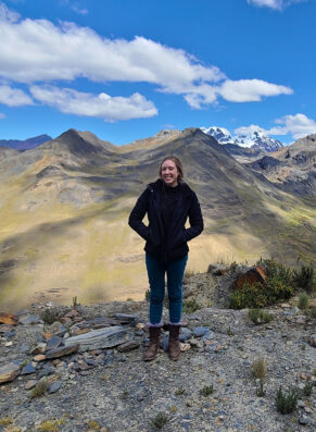 Katie Foster in front of a mountain range.