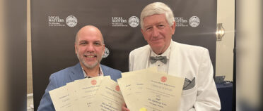 Andy Johnston and Dink NeSmith hold certificates won for The Oglethorpe Echo.