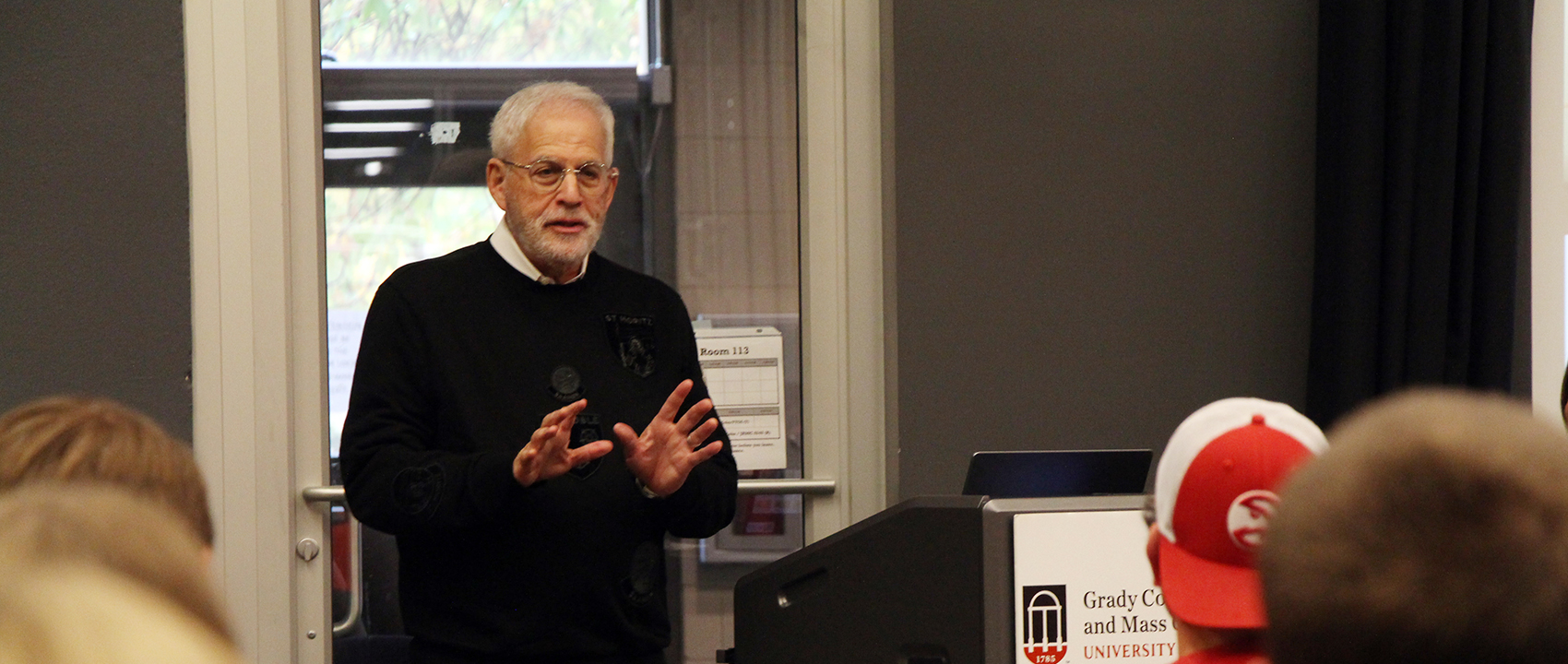 Adam Levin speaks to a group of students.