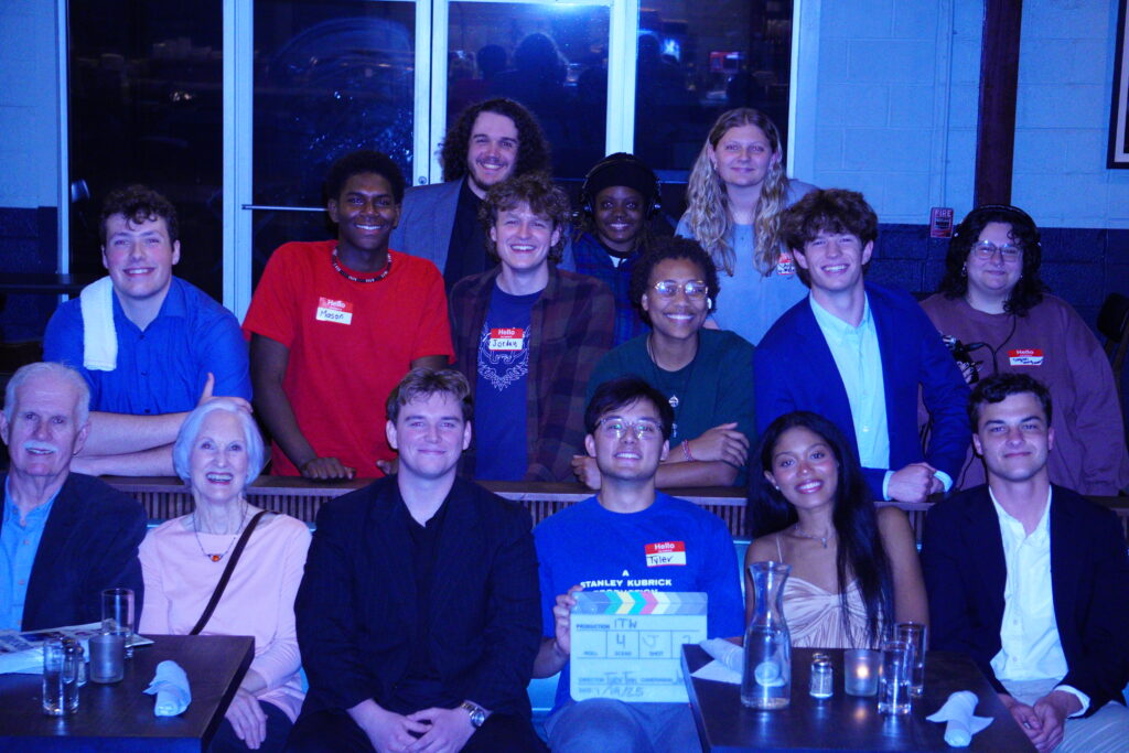 Anna poses with the cast and crew of a short film.