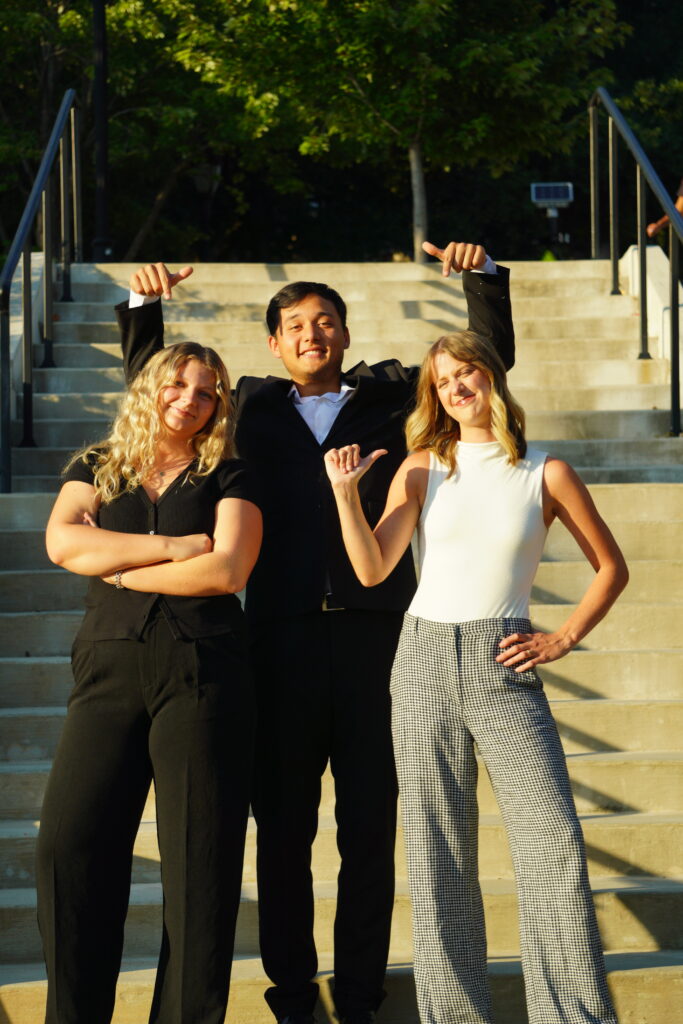 Anna (left) poses with Industry Club Exec outside of Grady College.
