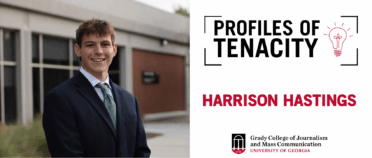 Harrison Hastings smiles for headshot at Schnitzer Family Lawn.