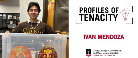 Ivan Mendoza is pictured holding a bucket for a book drive.