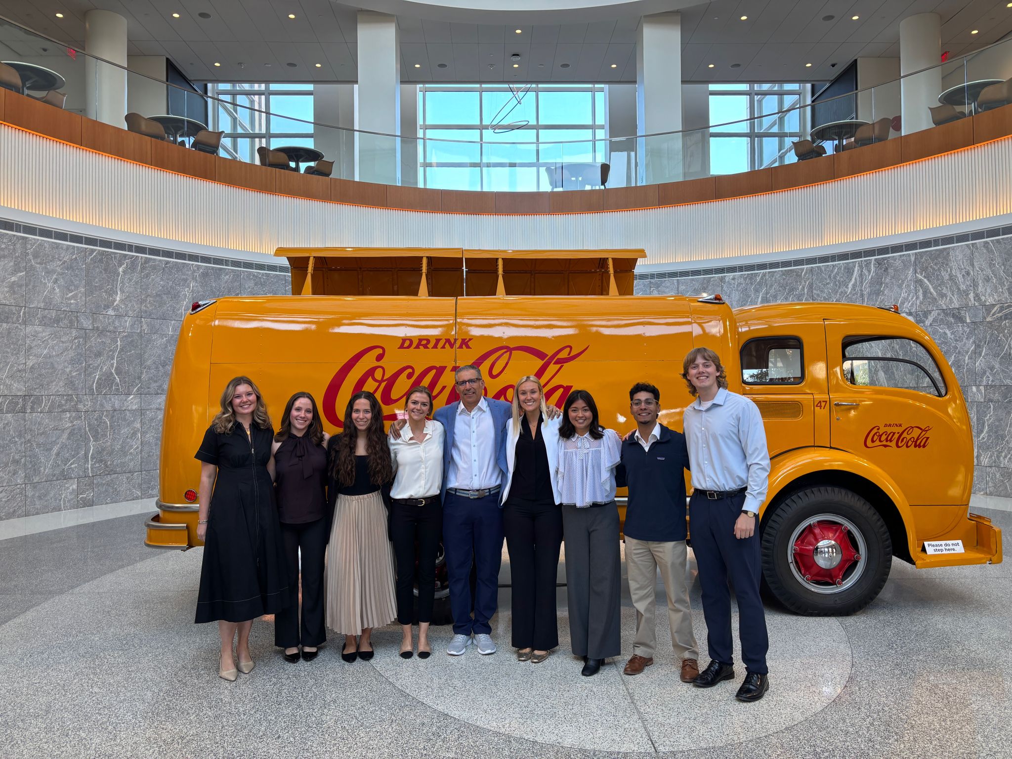 students in front of vintage Coca Cola truck