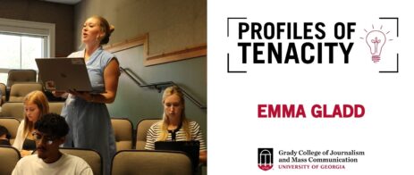 Emma Gladd is pictured standing up in a classroom to ask a question to a guest speaker.