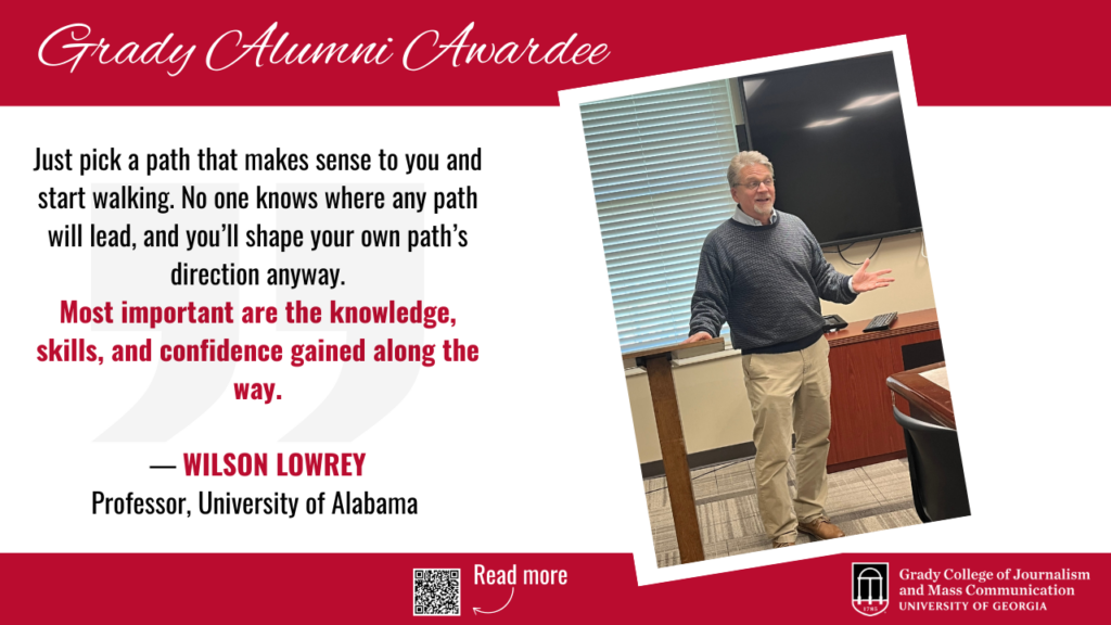 A man with gray hair and a beard, identified as Wilson Lowrey, stands and gestures while giving a talk in a classroom. A quote beside him highlights the importance of knowledge, skills, and confidence. The image is branded with Grady College of Journalism.