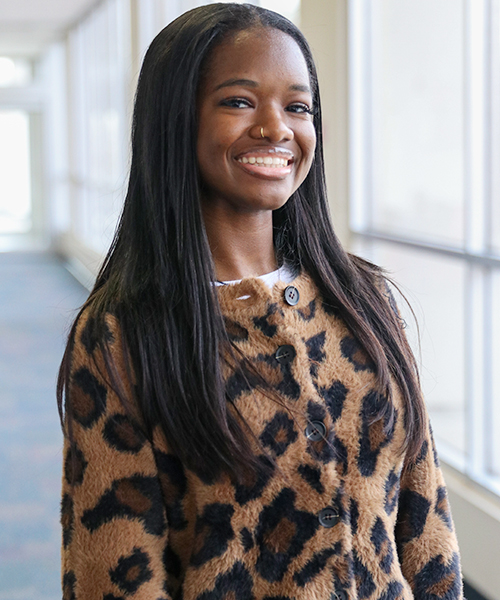 A young woman poses for a headshot photo.