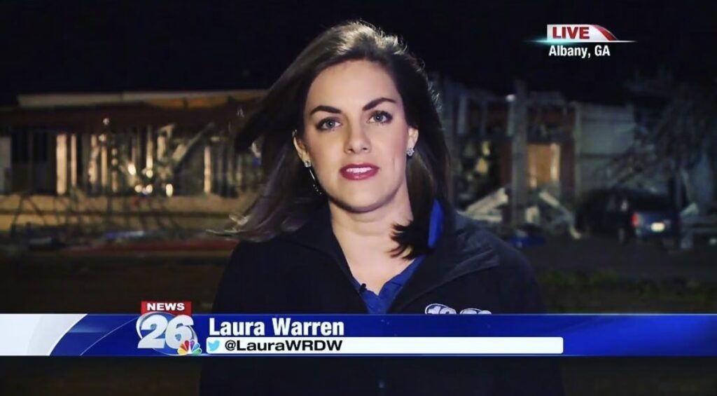 A female reporter speaks on live TV with a graphic showing her name is "Laura Warren" and a location in the top right that reads "Albany, Georgia."
