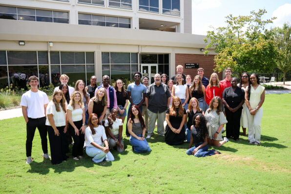 Group of students and Dean Davis in front of Grady College