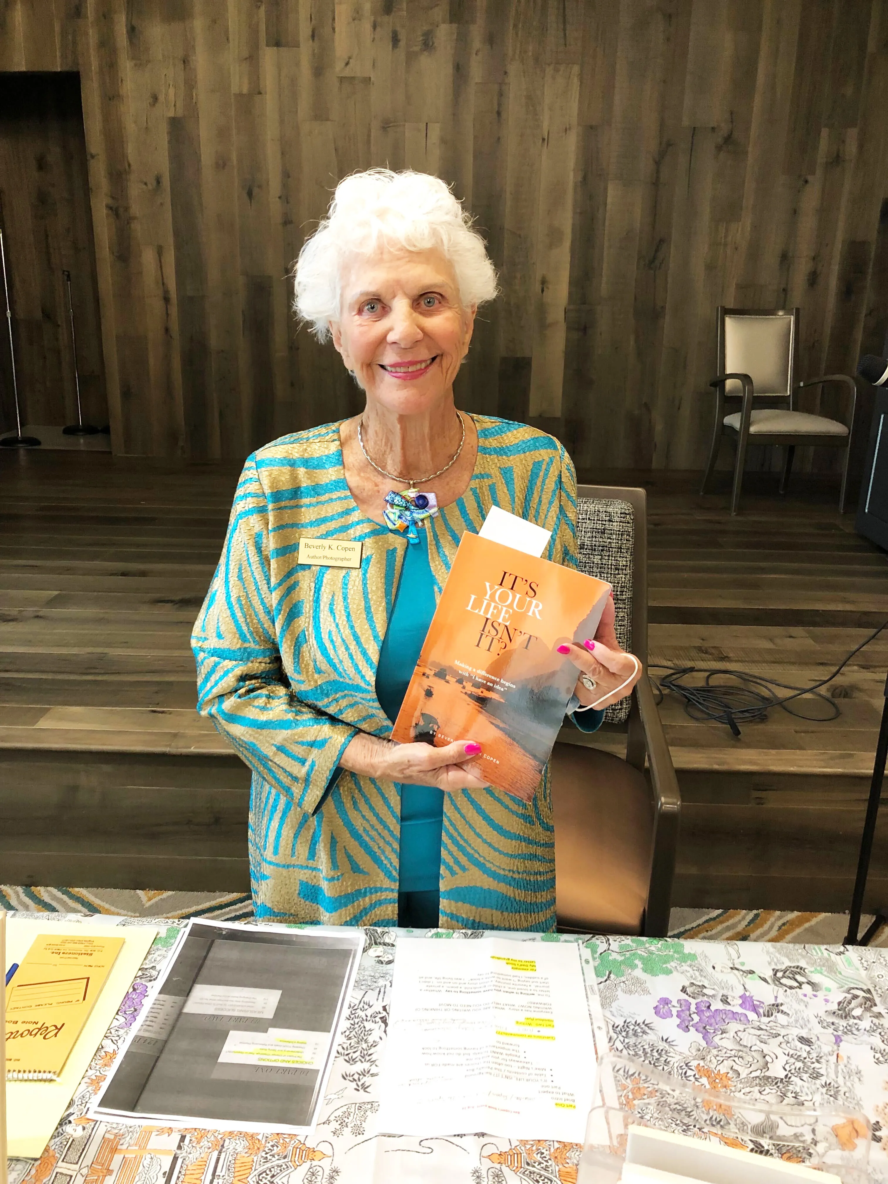 Beverly Copen holding her book "Its Your Life, Isn't It?"