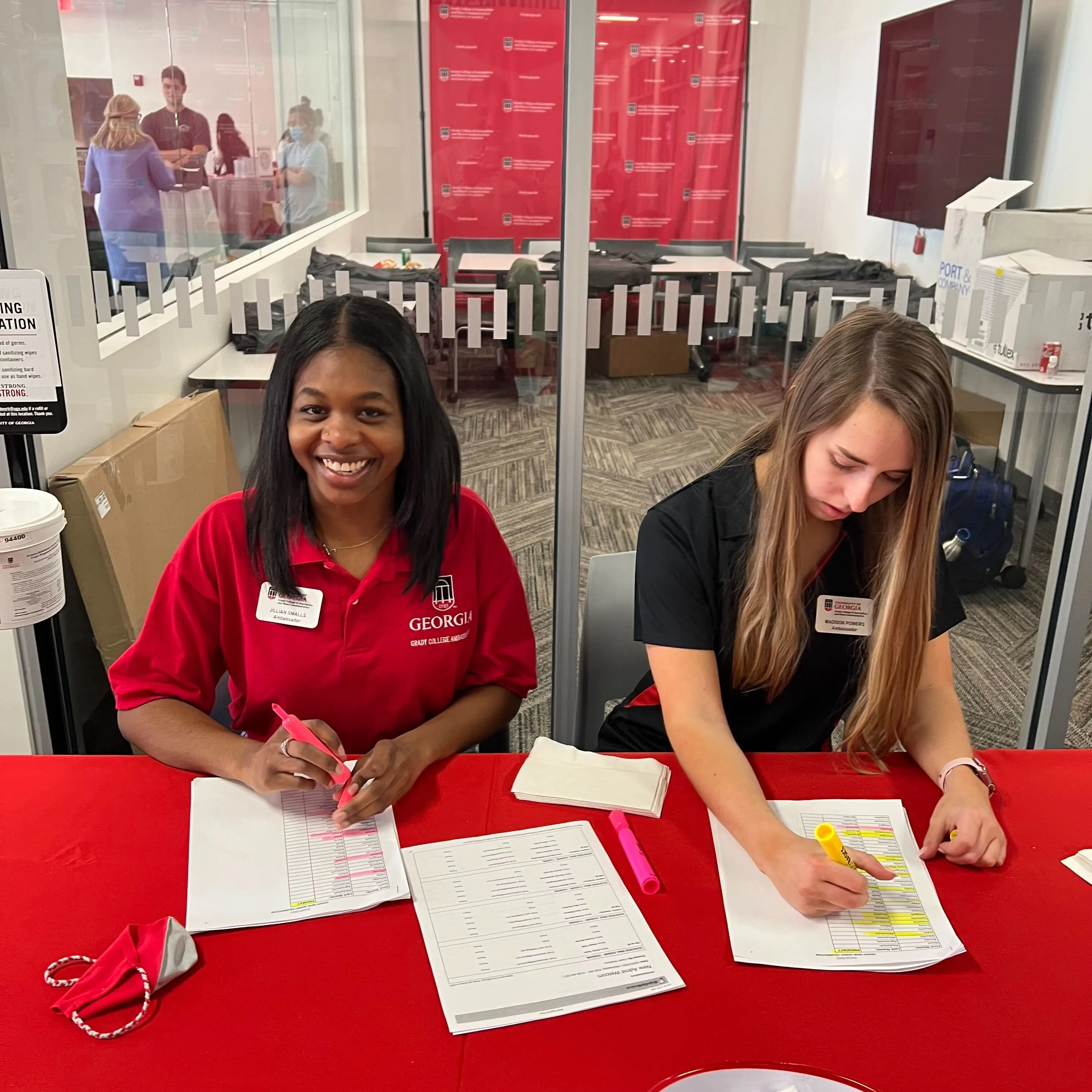Smalls and a fellow Grady Ambassador checking students in